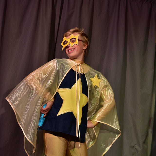 Image of camper in superhero costume